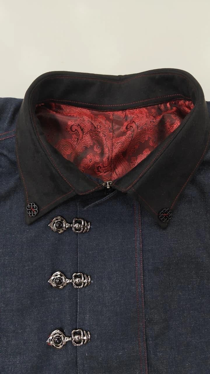The shirt's collar and silver clasps, showing the red jacquard lining and precise red topstitching.